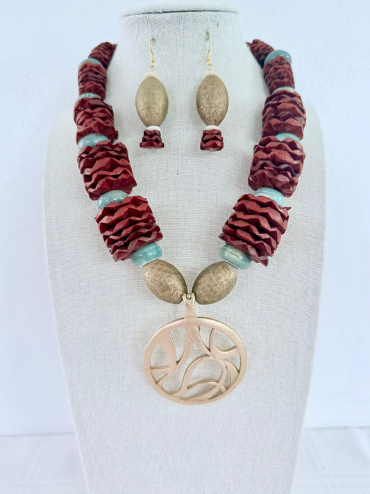 Saule necklace and earrings on display bust